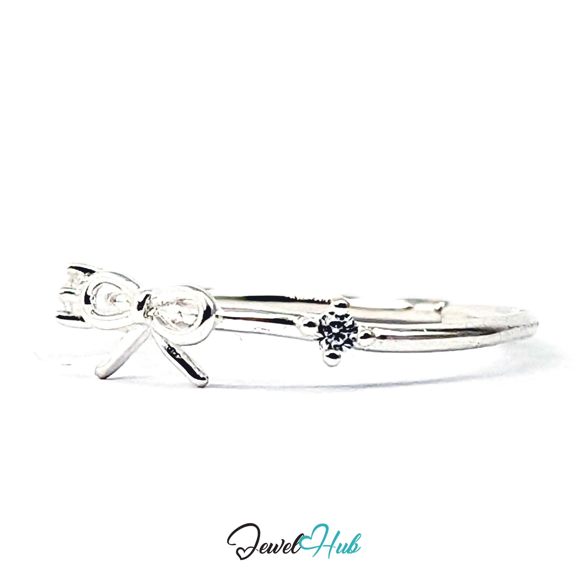Outline bow with falling tails and a clear crystal set on the band beside it - JewelHub