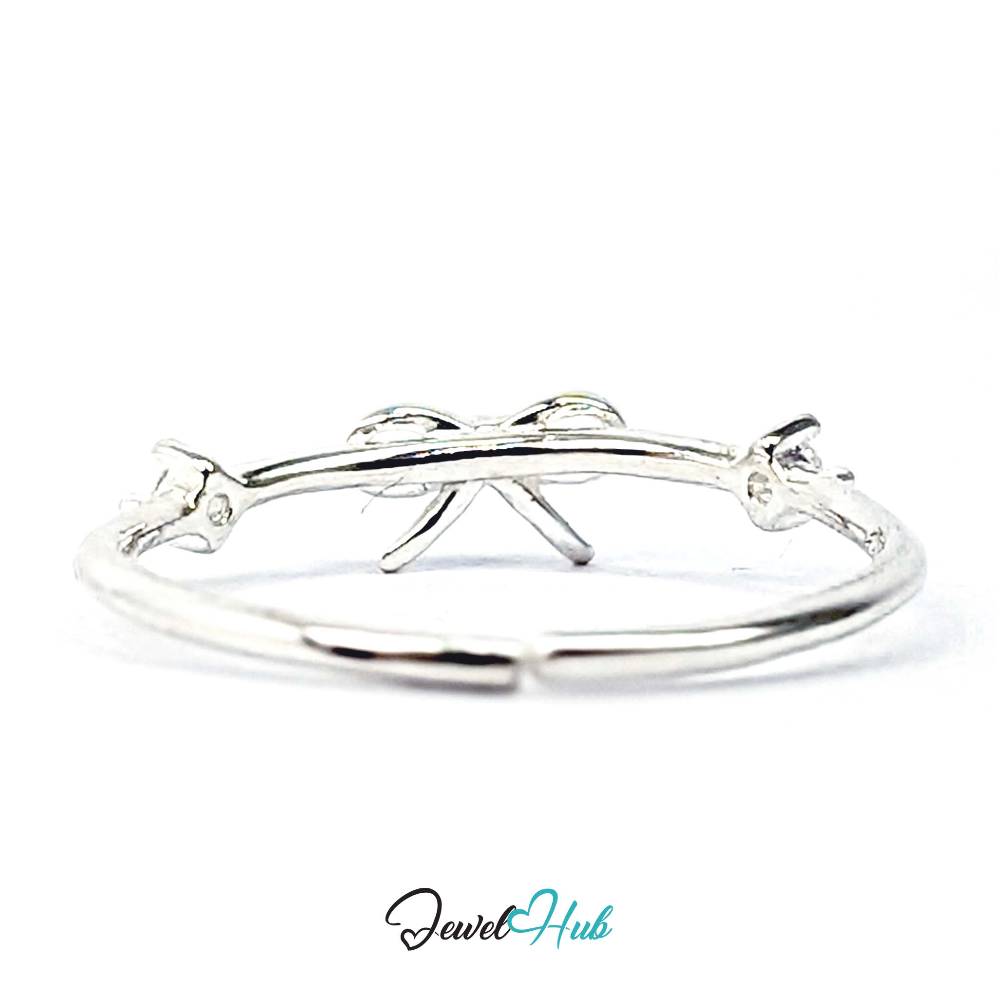 Open bow ring from above, with light passing through the outlined loops - JewelHub