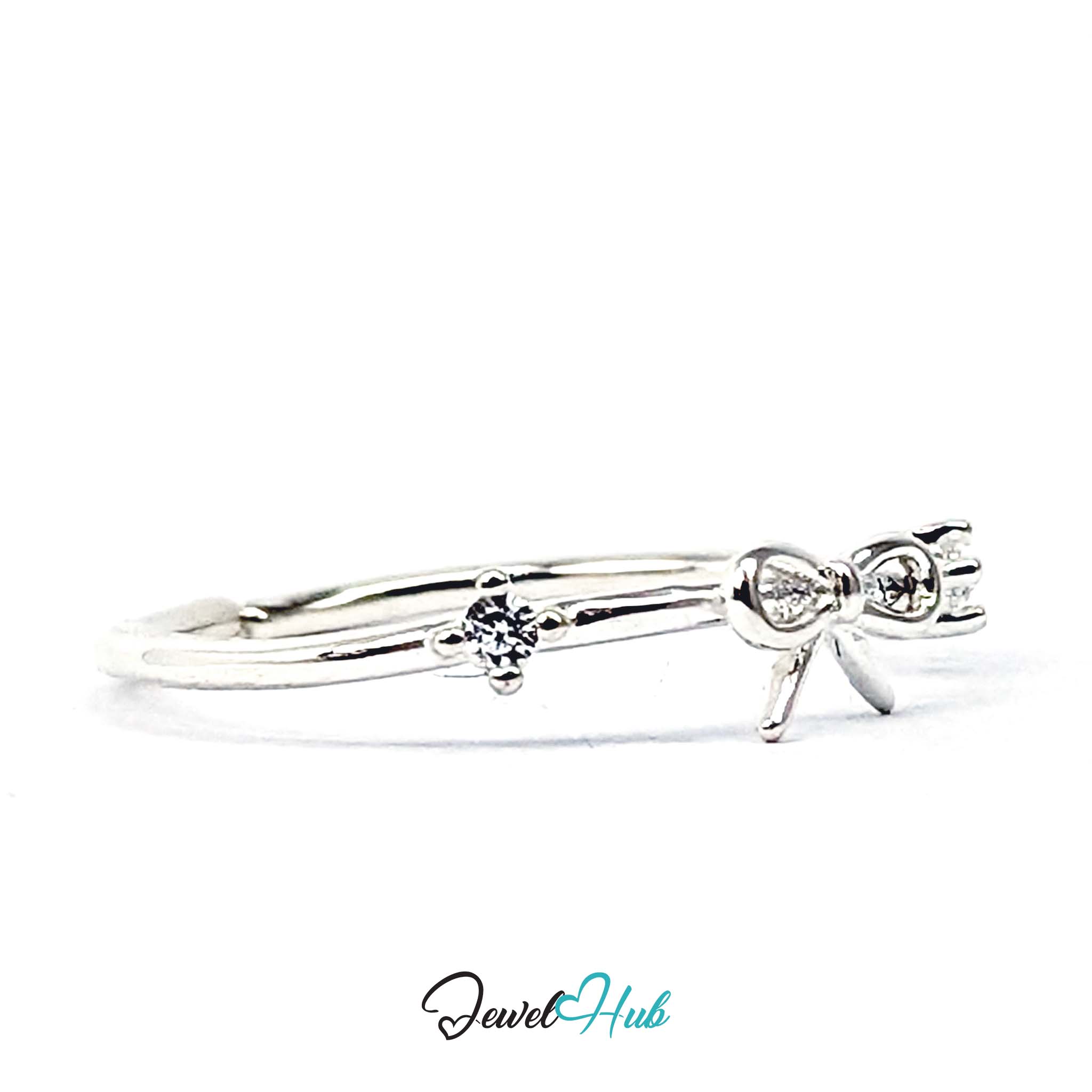 Open bow ring at an angle, with one prong-set crystal in the foreground - JewelHub
