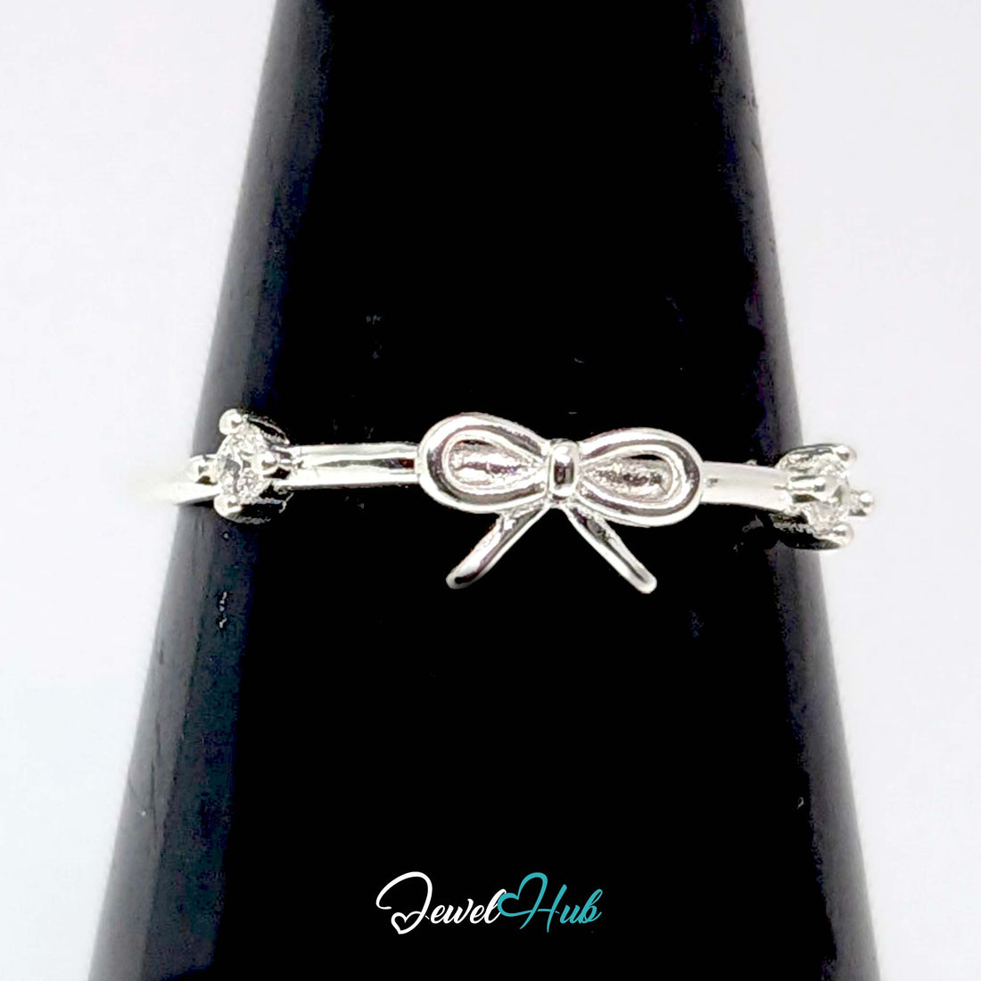 925 sterling silver open bow ring with a prong-set crystal on each side - JewelHub