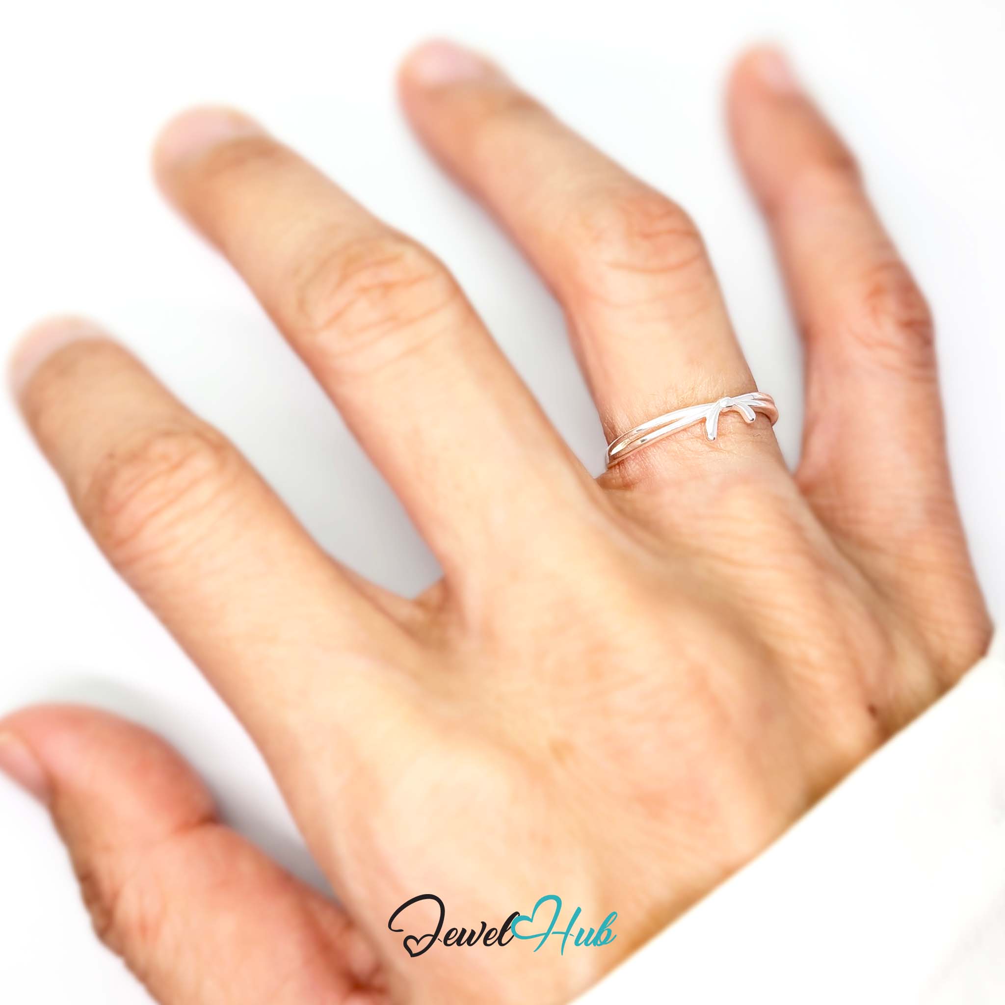 Ribbon ring worn on a hand, showing the fit of the adjustable L-N band - JewelHub