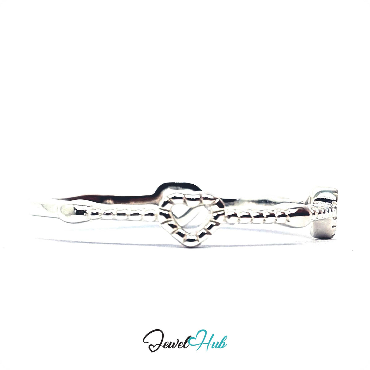 Three hearts ring at an angle, with one open heart in the foreground - JewelHub