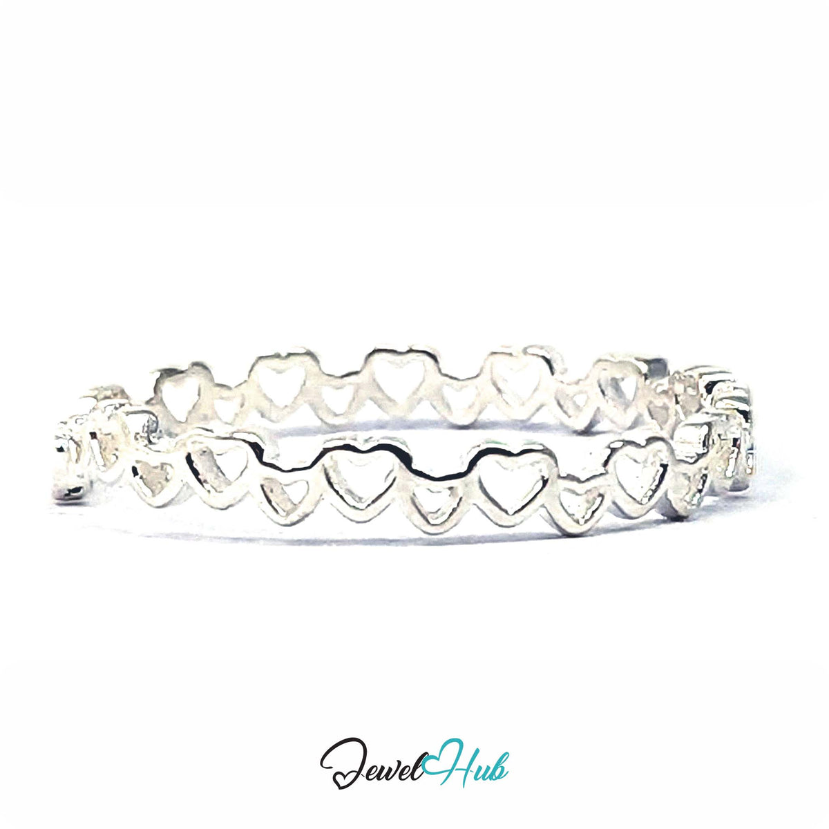 Linked hearts band at an angle, with light passing through the open hearts - JewelHub