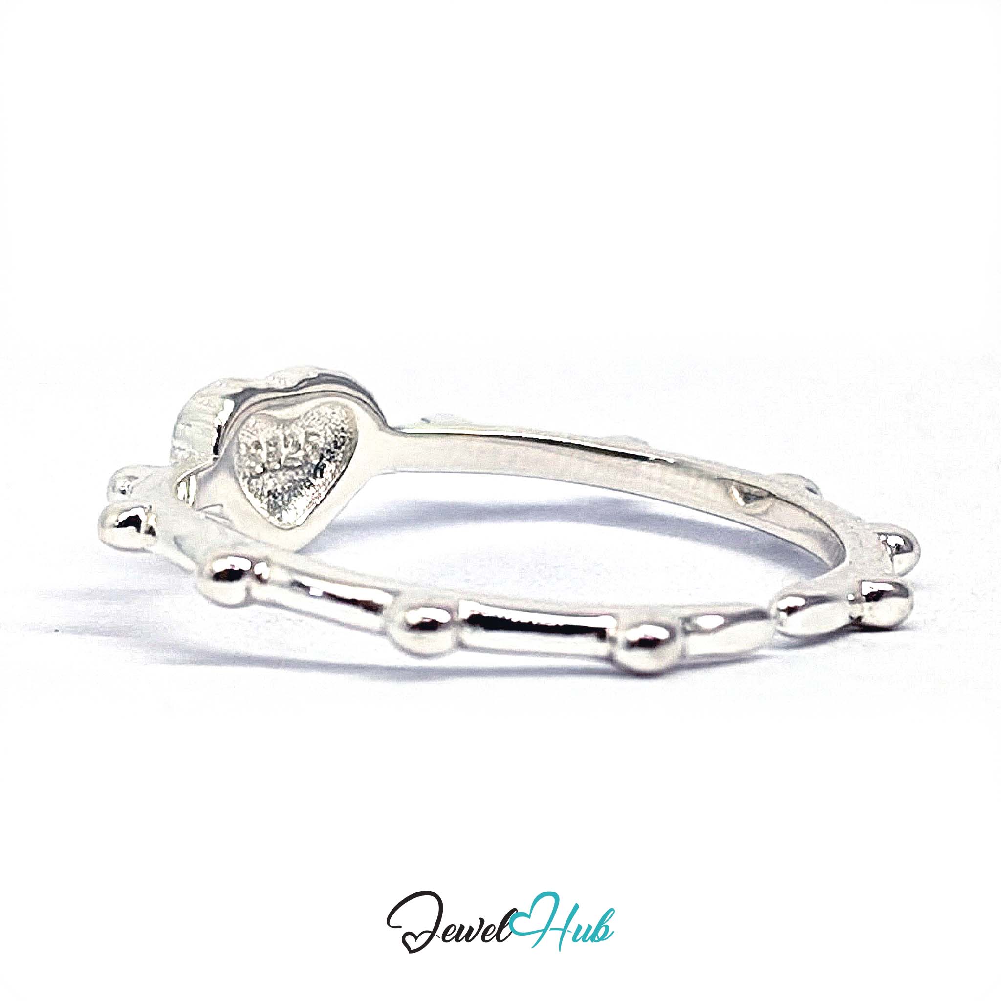 Cross heart ring rotated to show the beaded links running round the band - JewelHub