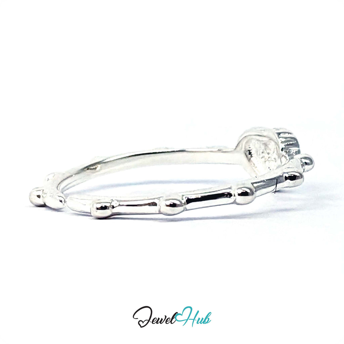 Side view of the cross heart ring, showing the raised heart panel - JewelHub
