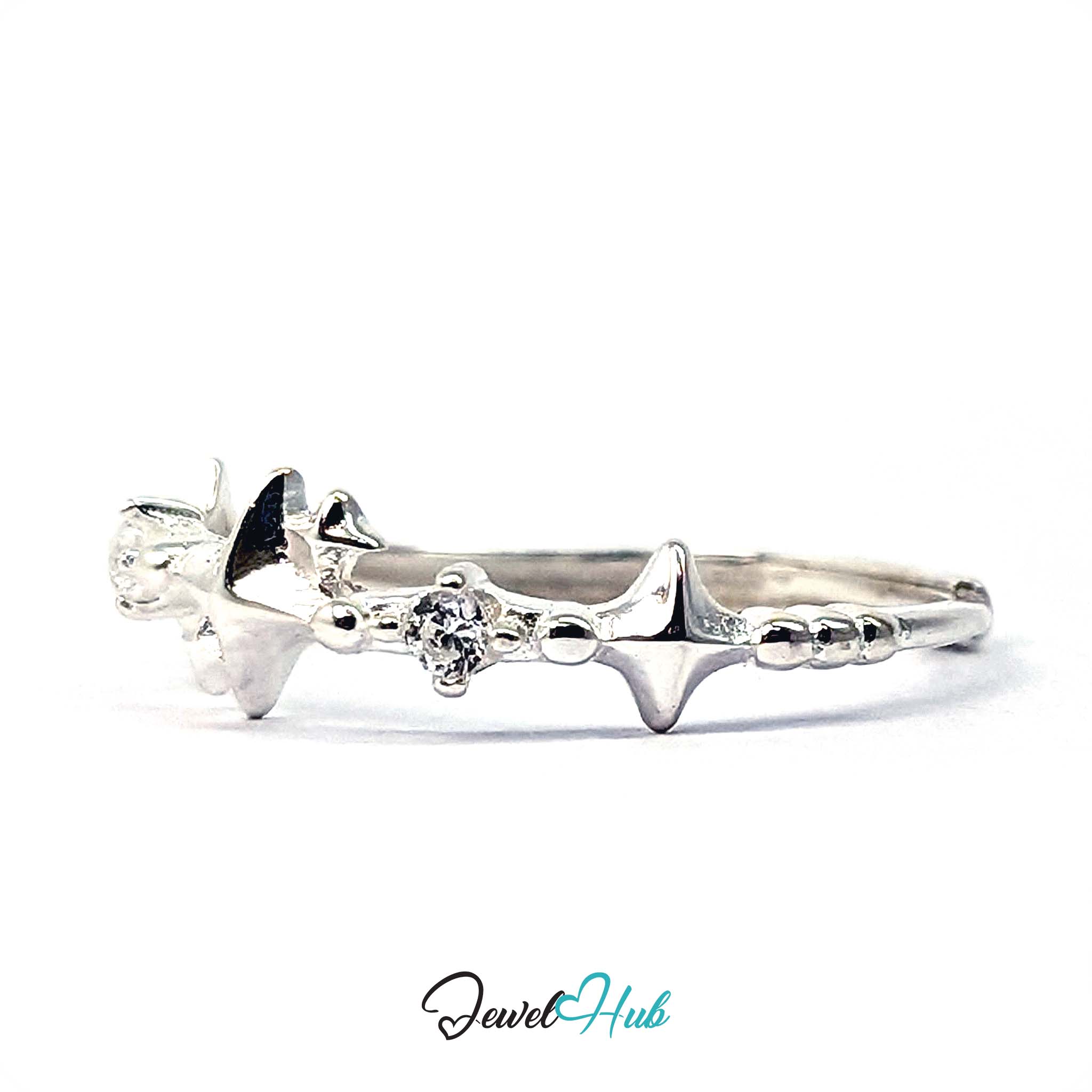 Four-point stars and clear crystals alternating along a 999 fine silver band - JewelHub