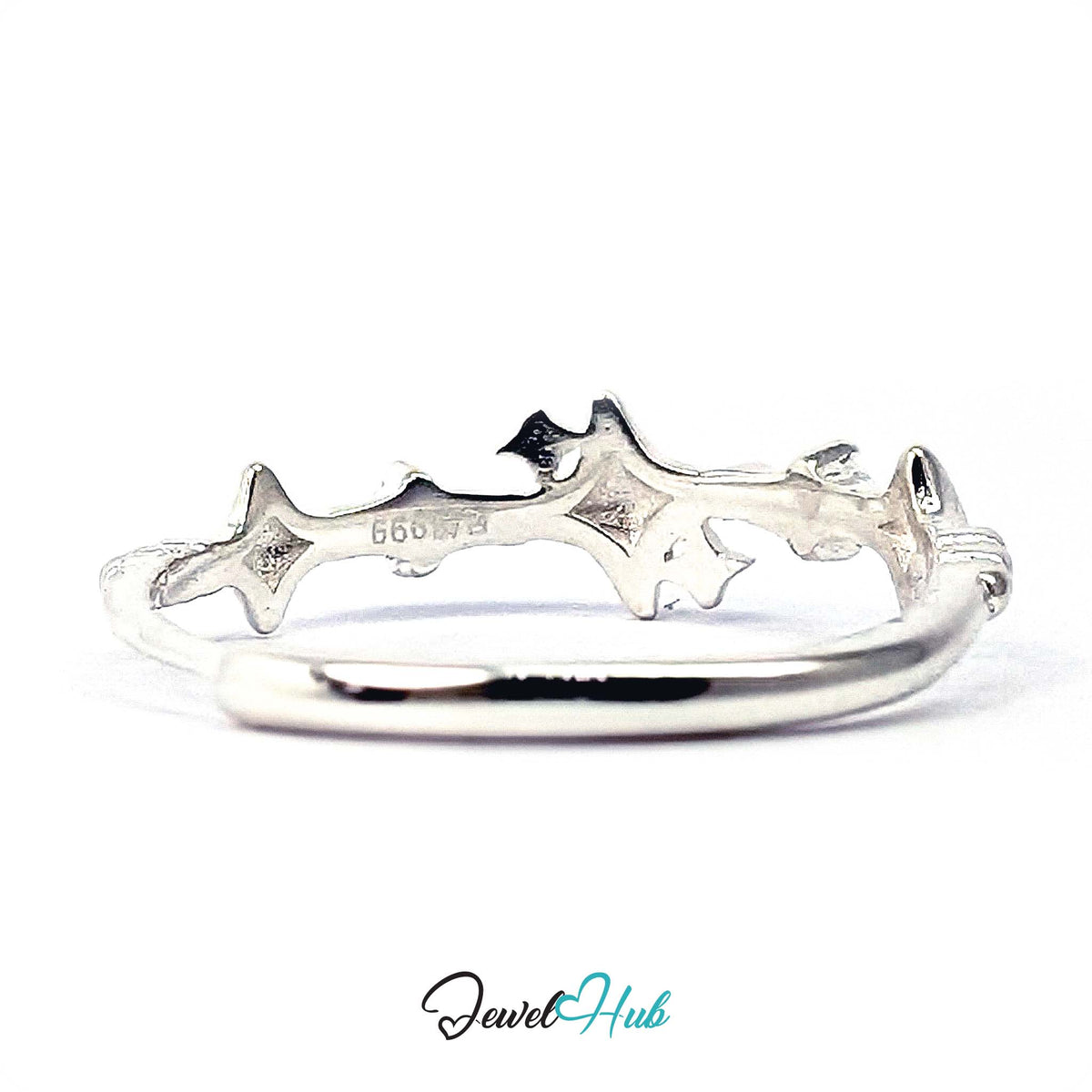 Sparkle ring from above, showing the raised four-point star forms - JewelHub