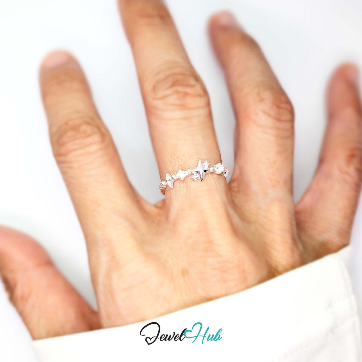 Sparkle ring worn on a hand, showing the fit of the adjustable M-O band - JewelHub