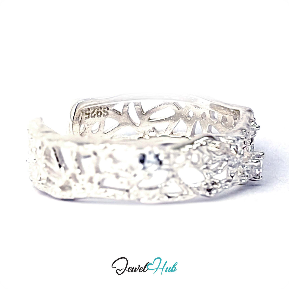 Three-quarter view of the openwork ring with the S925 stamp visible - JewelHub