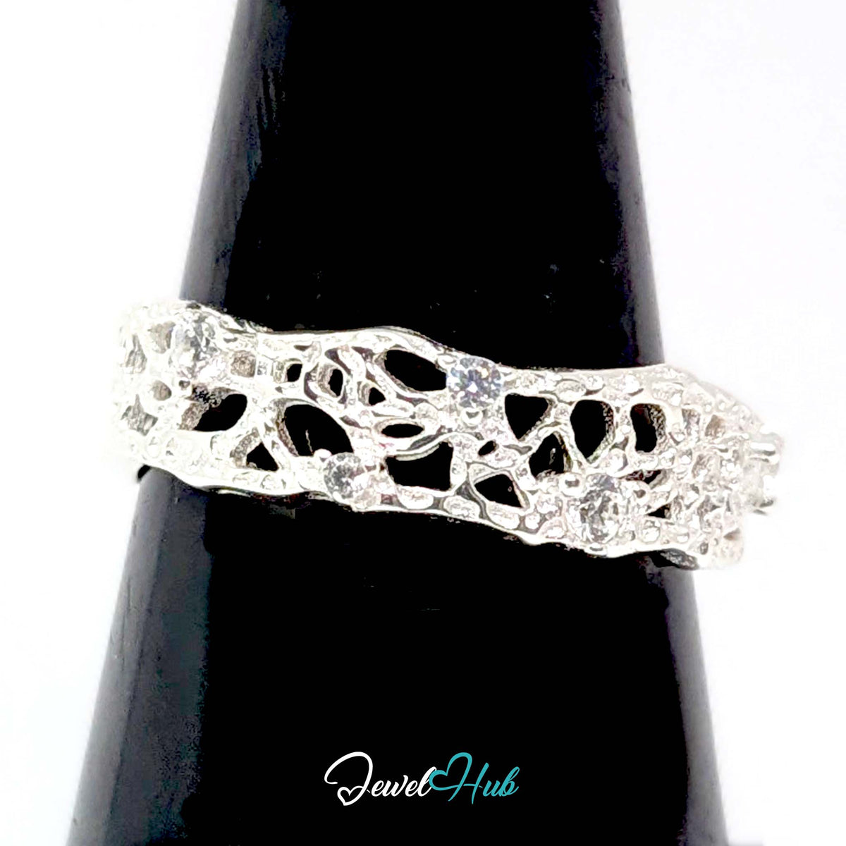 Openwork lattice ring on a black cone display, showing the pierced band - JewelHub
