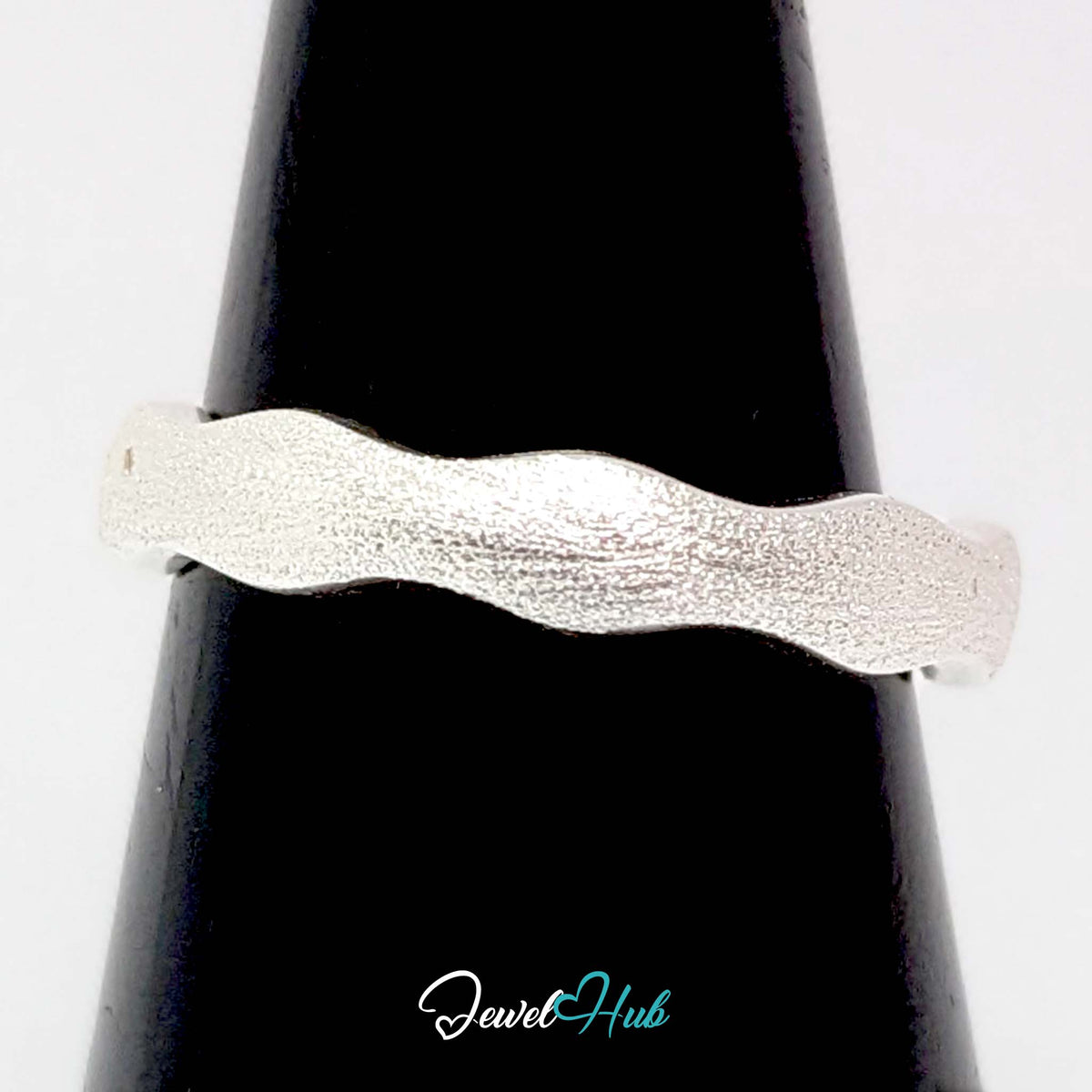 Wave edge band on a black cone display, showing the rippled edges - JewelHub