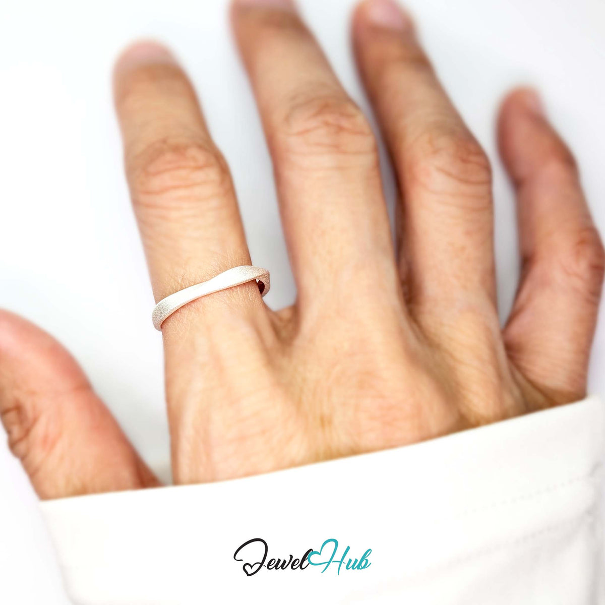 Mobius twist ring worn on a hand, showing the larger P-R fit - JewelHub