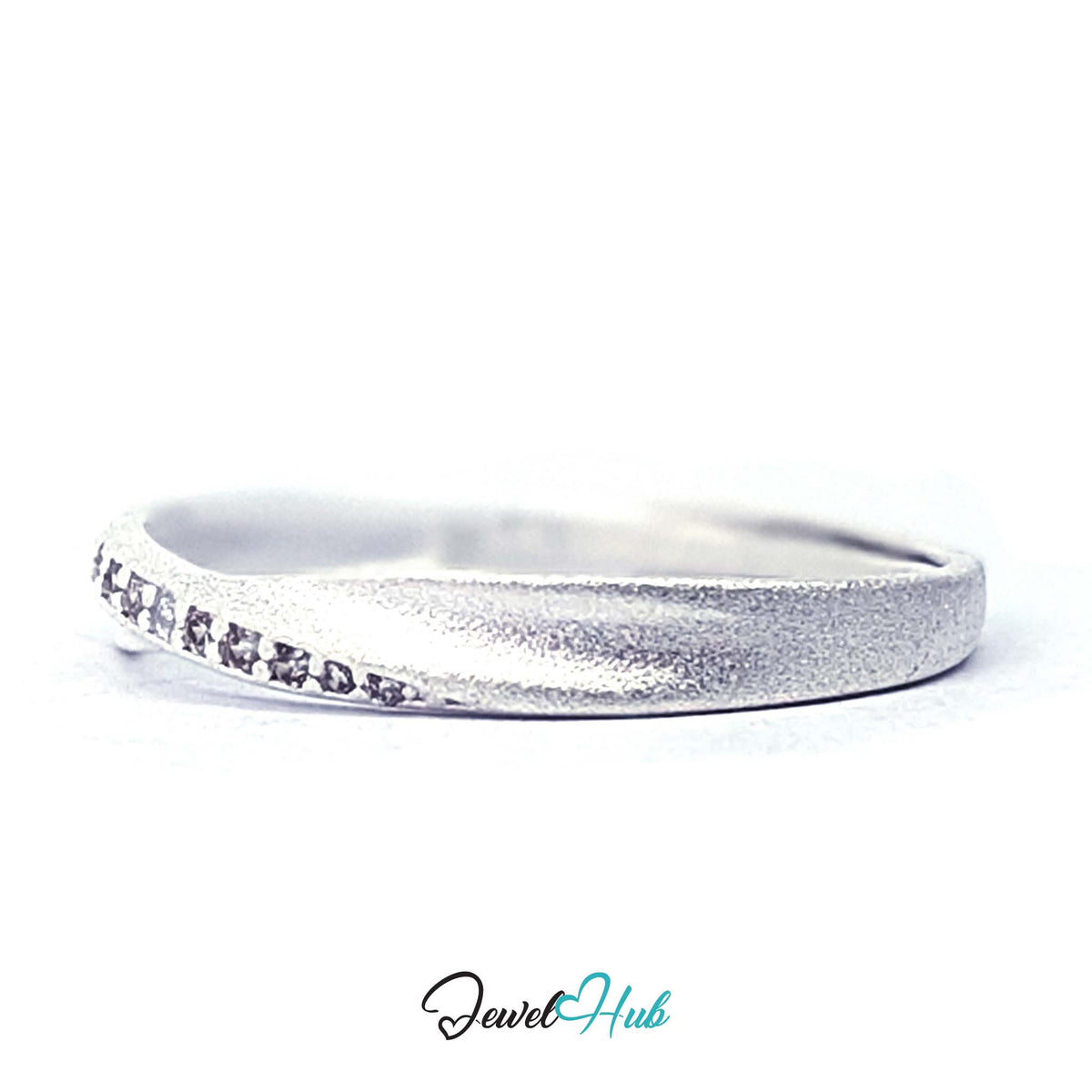 Side view of the row of eleven zirconia following the twist of the band - JewelHub