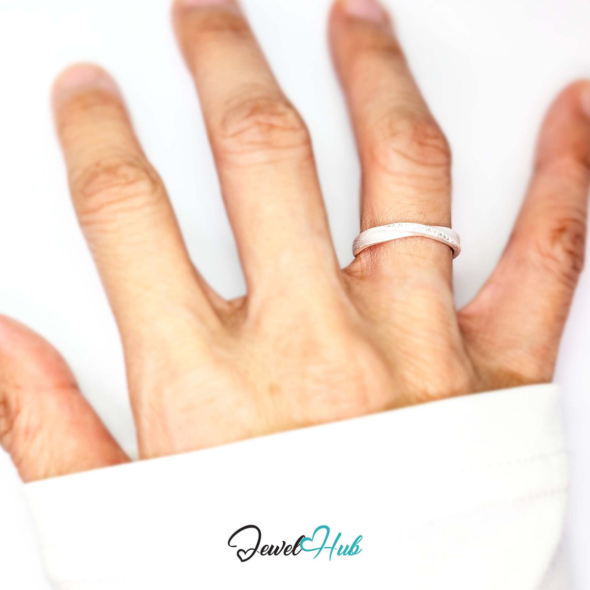 Mobius twist ring worn on a hand, showing the L-N fit - JewelHub