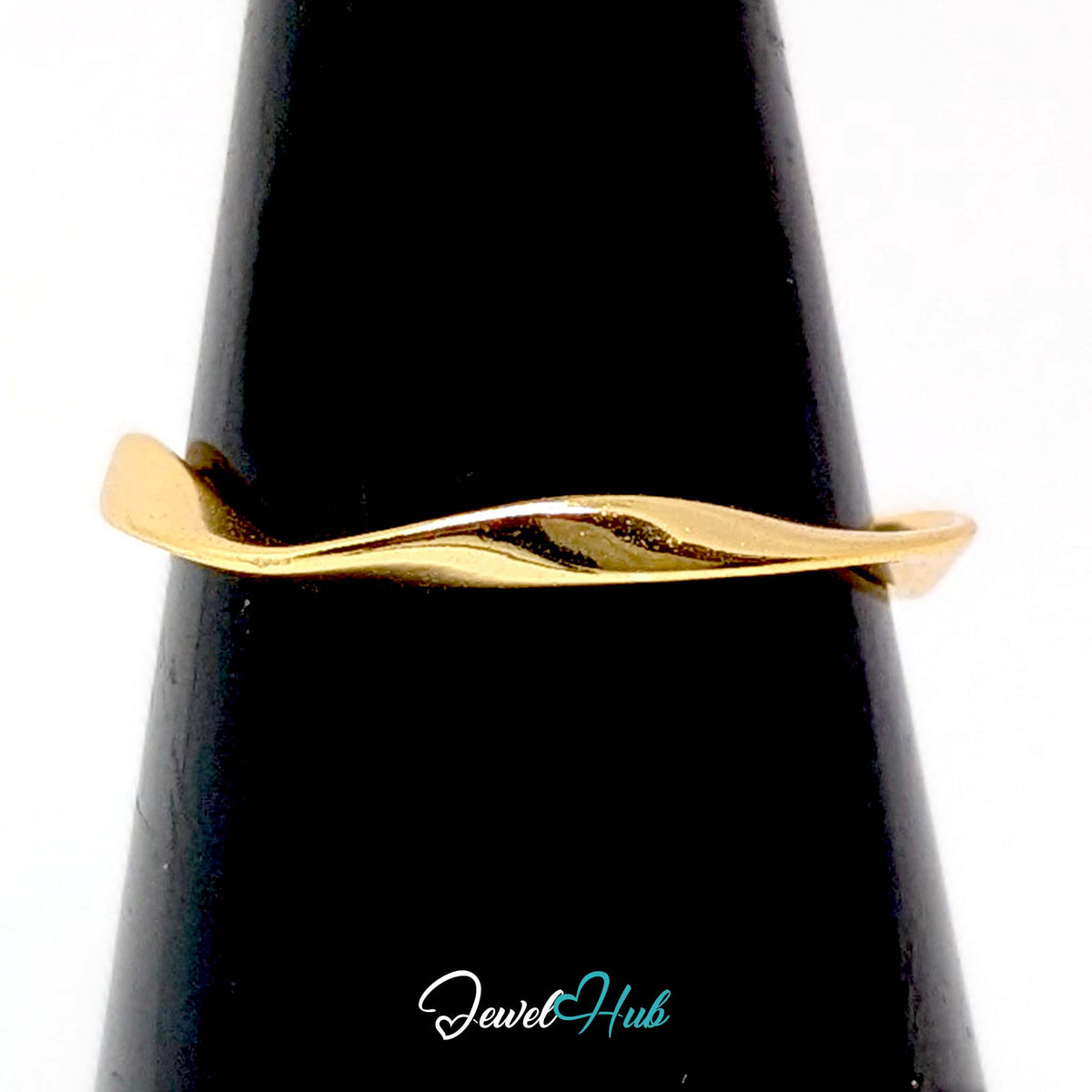 Gold-plated twist ring on a black cone display, showing the twisted band - JewelHub