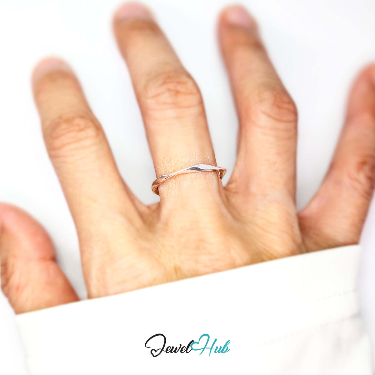 Twist wave ring worn on a hand, showing the adjustable M-O fit - JewelHub