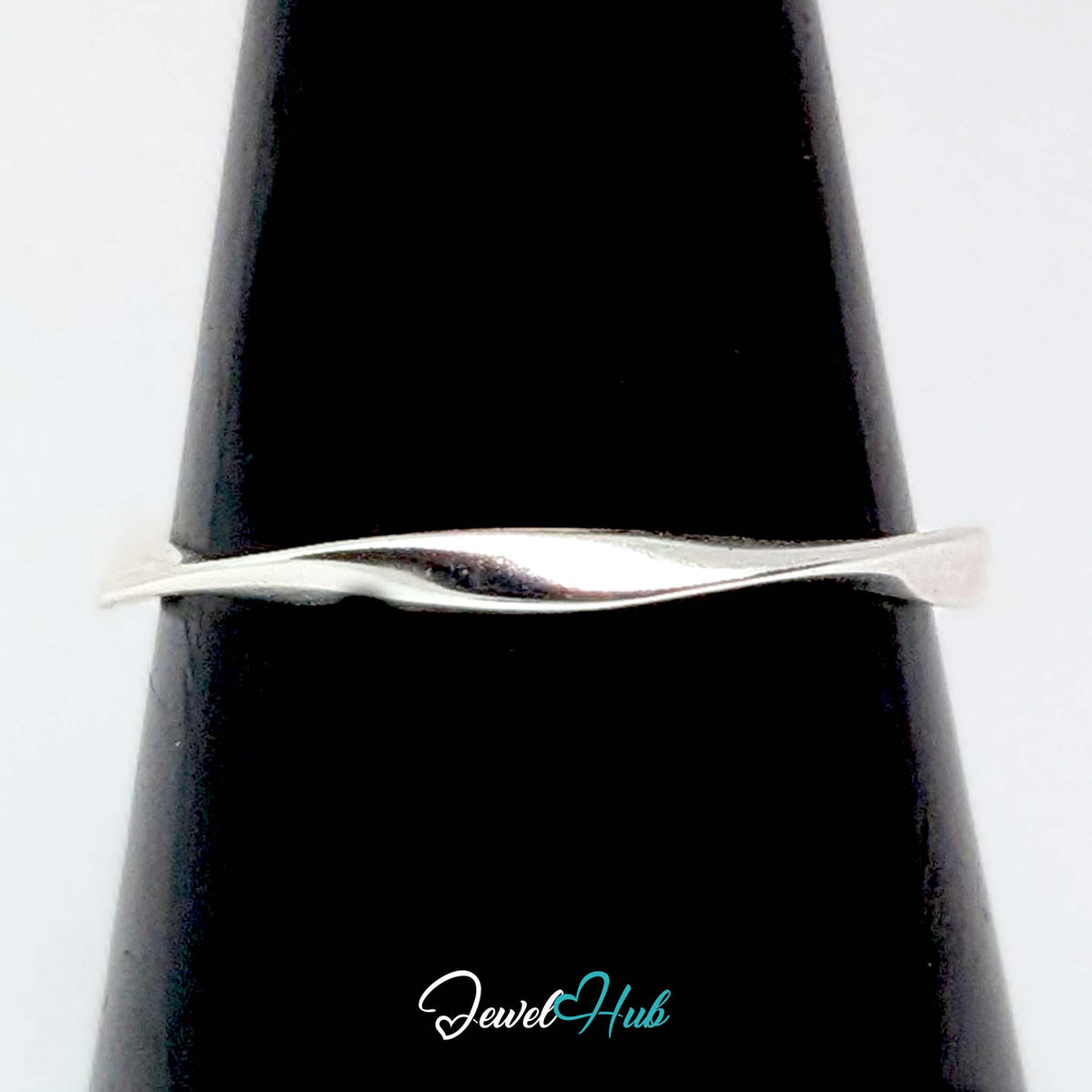 Twist wave ring on a black cone display, showing the turn in the band - JewelHub