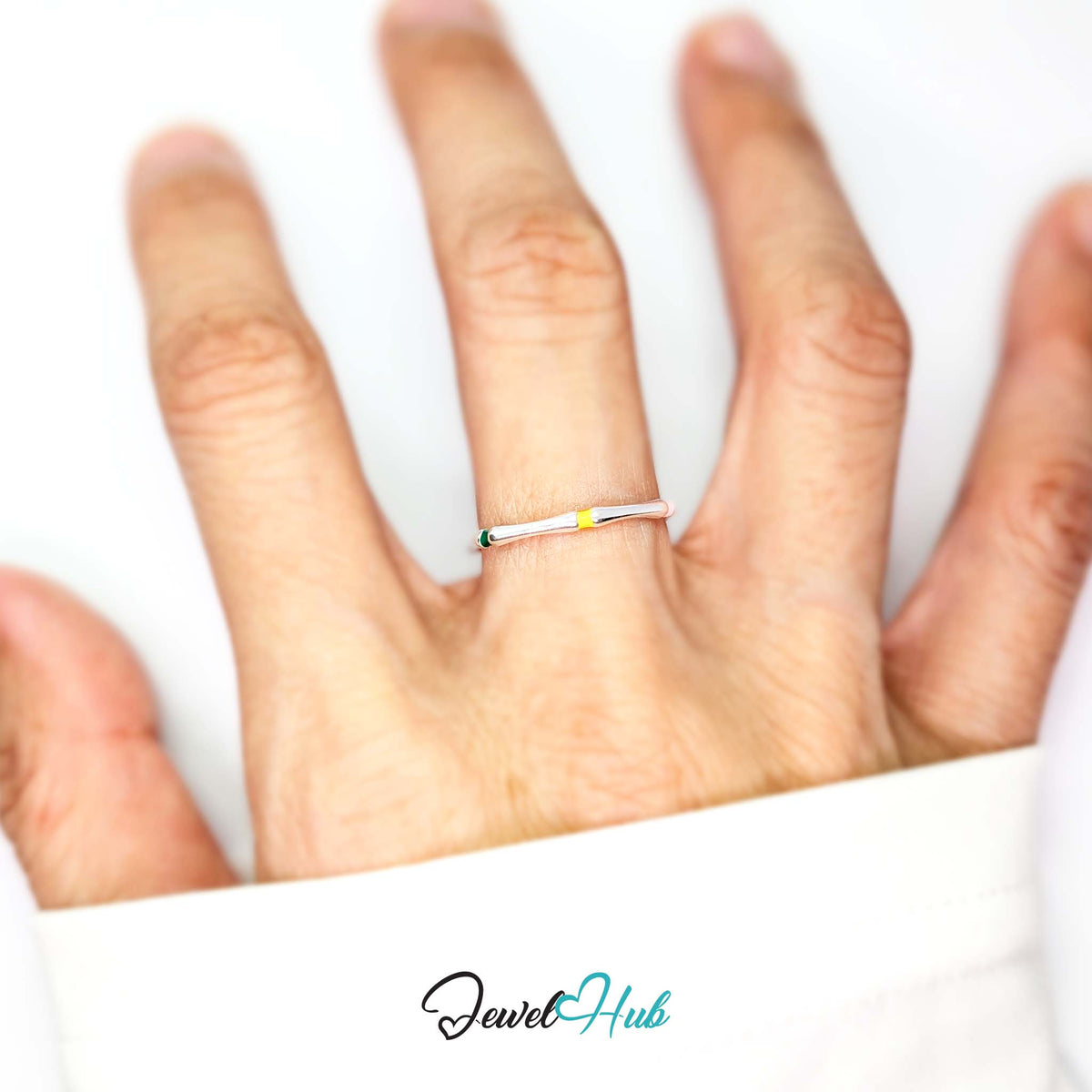Enamel ring worn on a hand, showing the slim band and colour detail - JewelHub