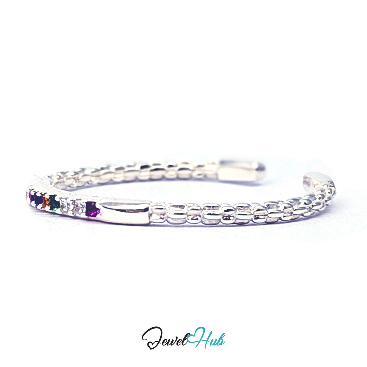 Angled view of the coloured zirconia set in the polished front bar - JewelHub