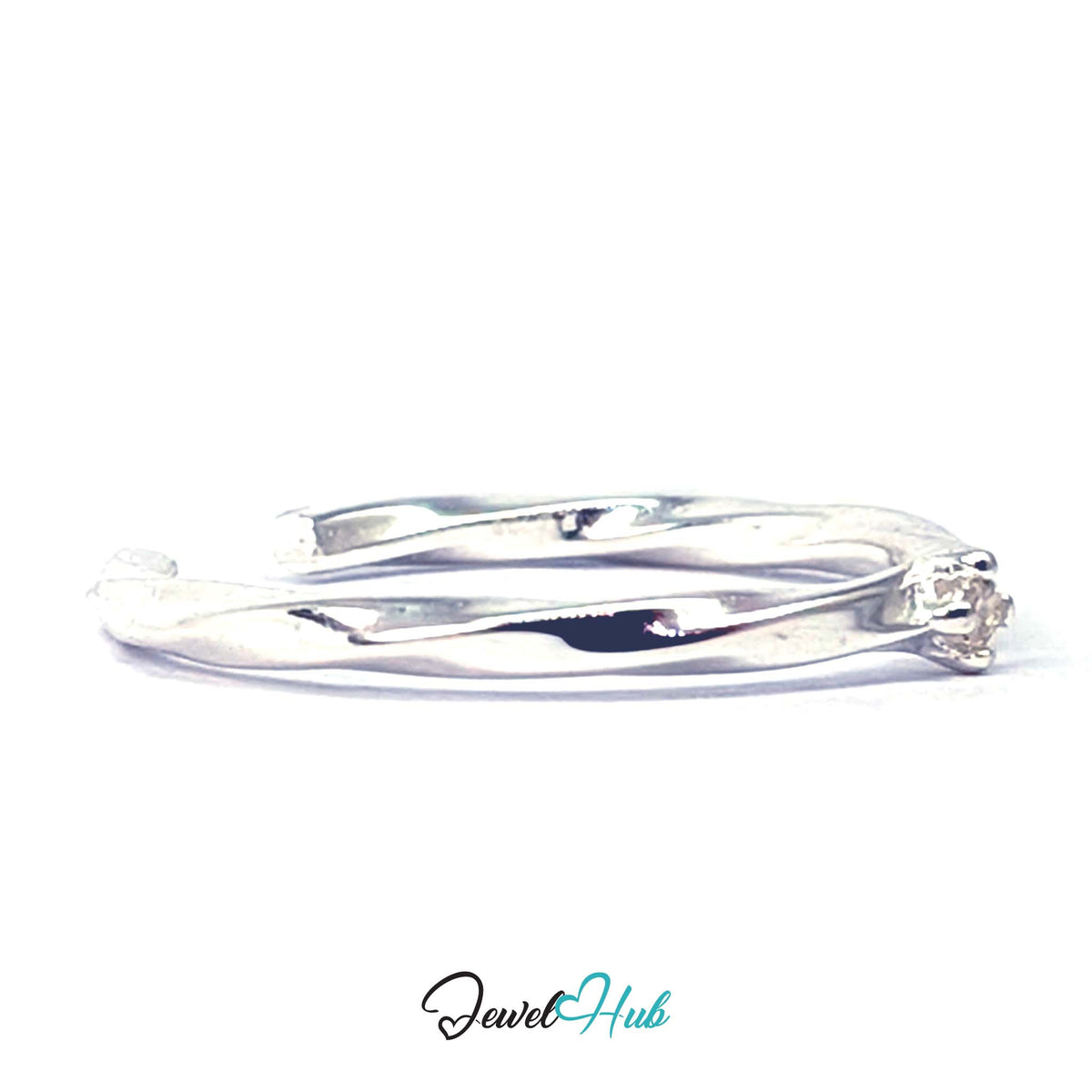 Angled view of the claw-set zirconia where the twist passes the top - JewelHub