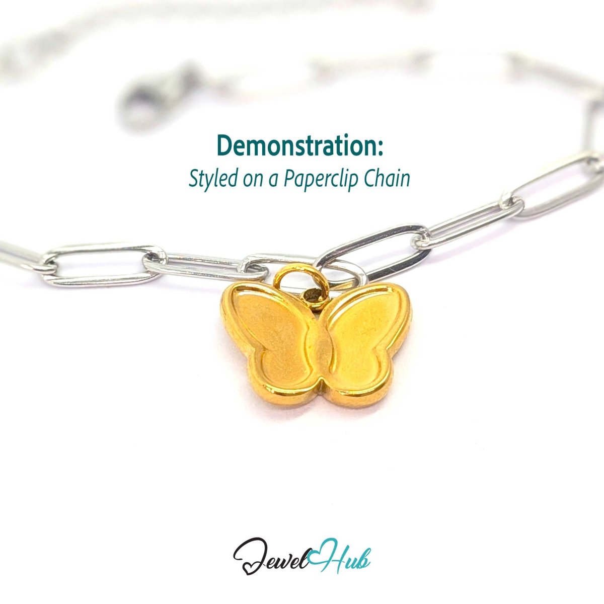 Gold butterfly charm styled on a silver paperclip chain for a two-tone mixed-metal look - JewelHub