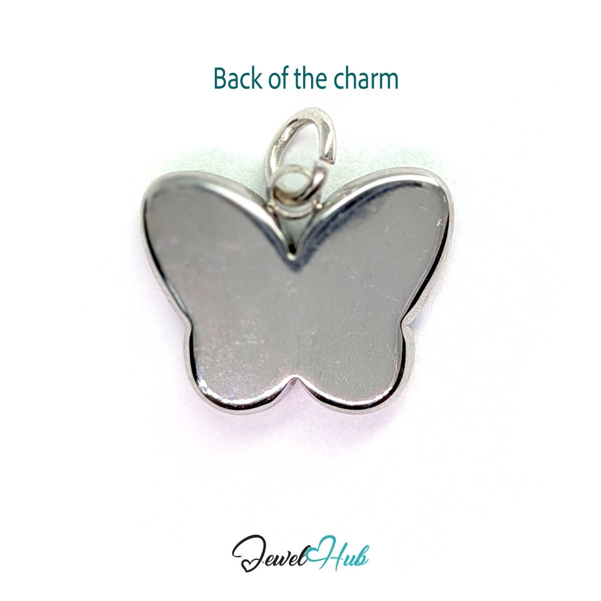 Back of the silver butterfly charm - a smooth polished steel panel, suitable for engraving - JewelHub