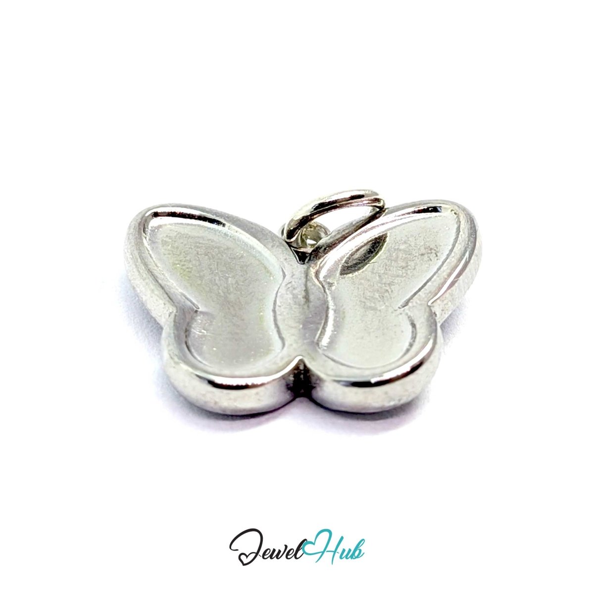 Overhead angled view of the silver butterfly charm showing the curve of each wing panel - JewelHub