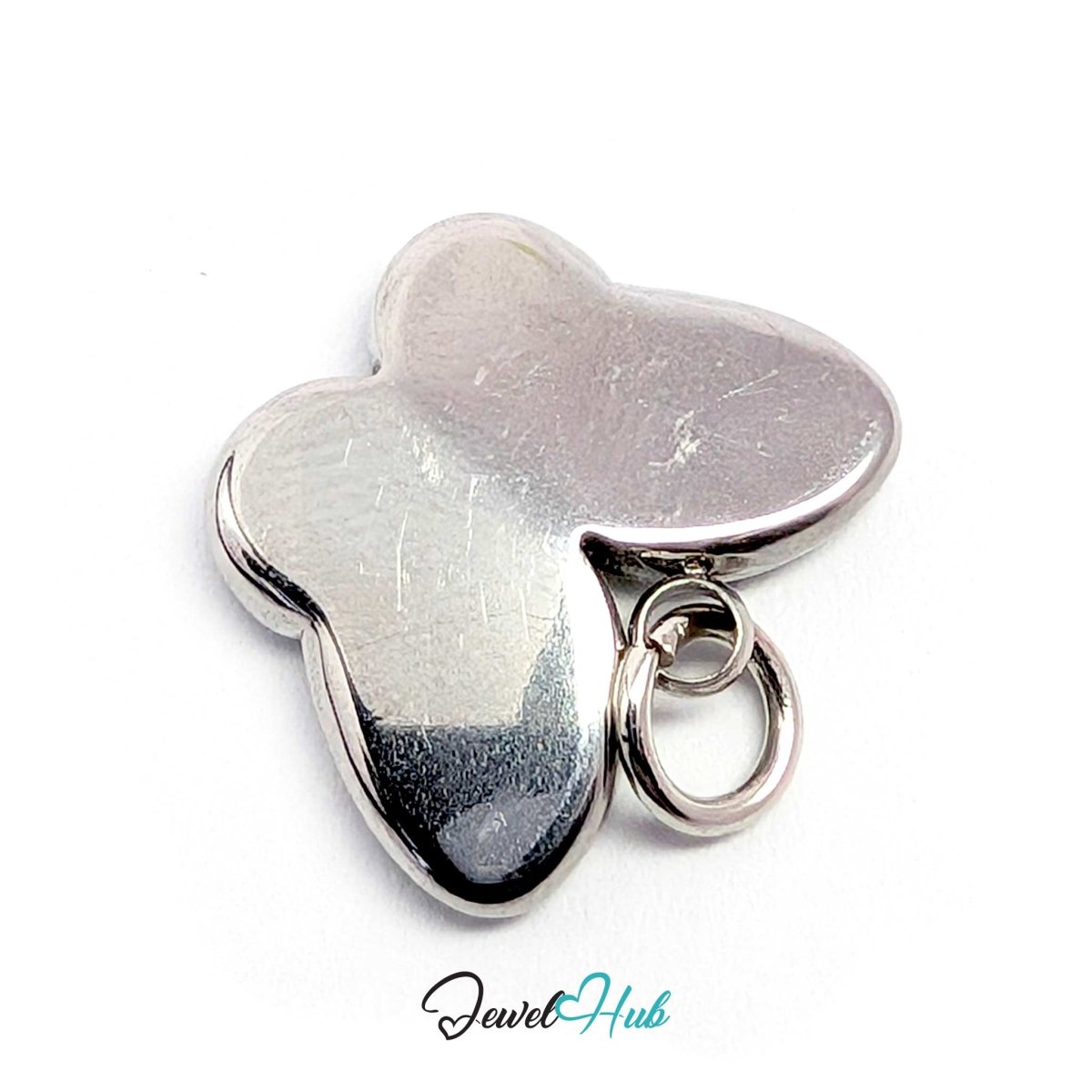 Rear three-quarter view of the silver butterfly charm with its jump ring - JewelHub