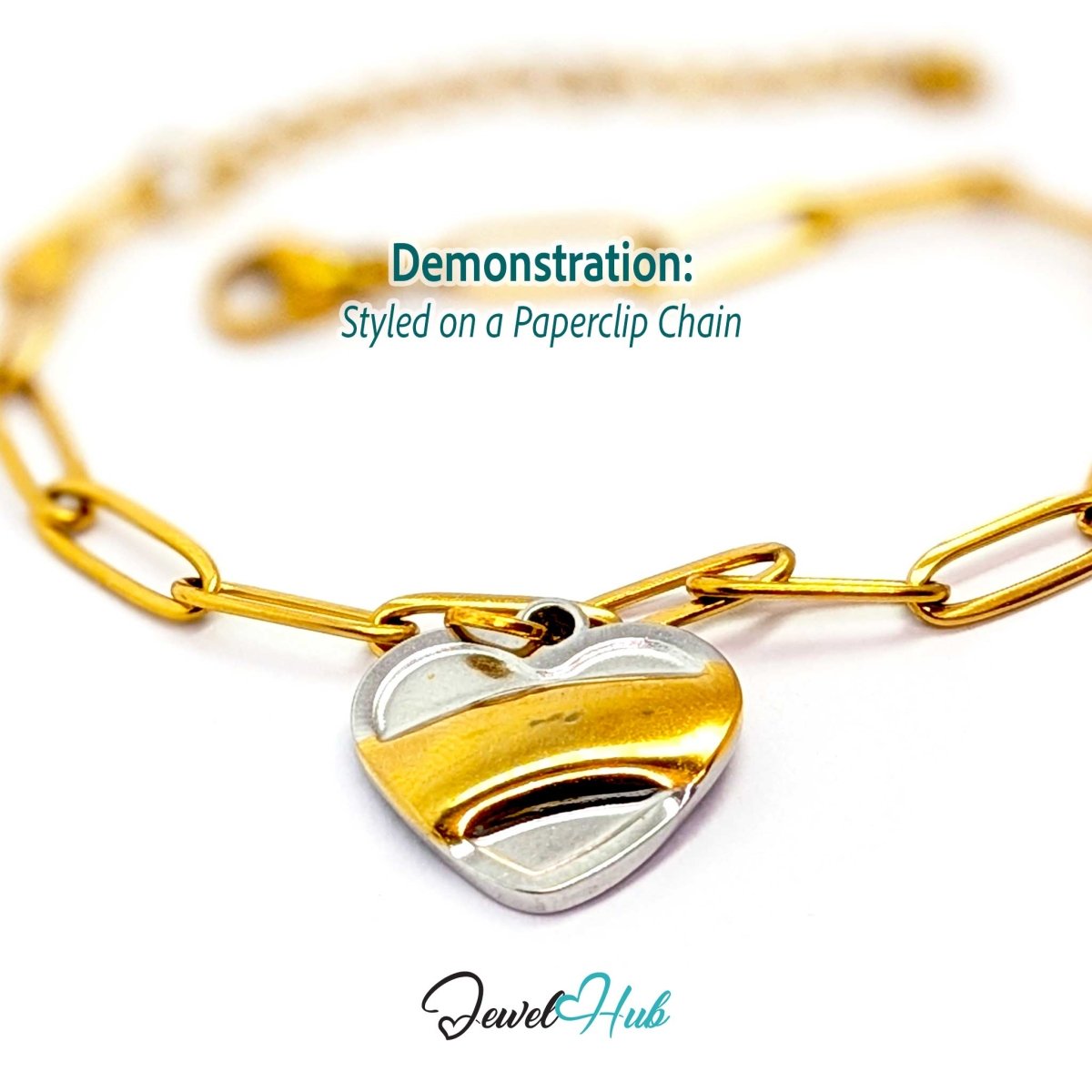 Two-tone Curve Heart charm styled on a gold paperclip chain bracelet - JewelHub