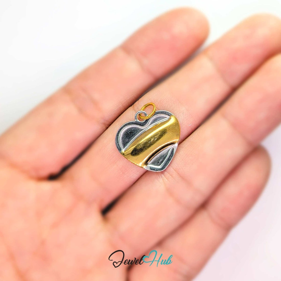 Curve Heart charm in two-tone stainless steel, one broad gold sweep across a mirror-polished silver heart - JewelHub