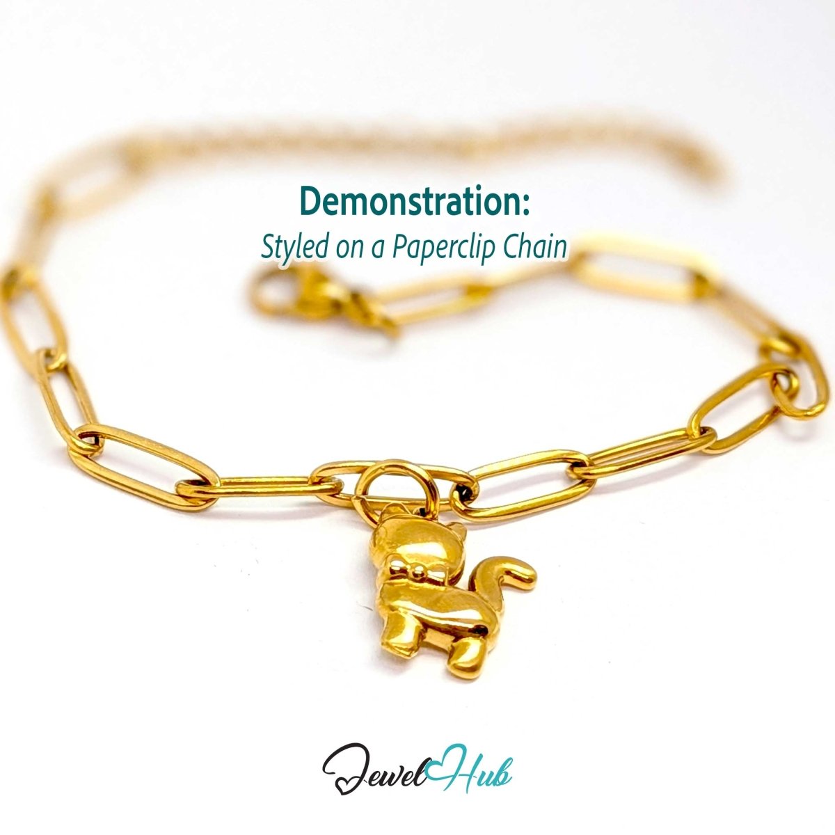 Gold cute cat charm styled on a gold paperclip chain bracelet - JewelHub