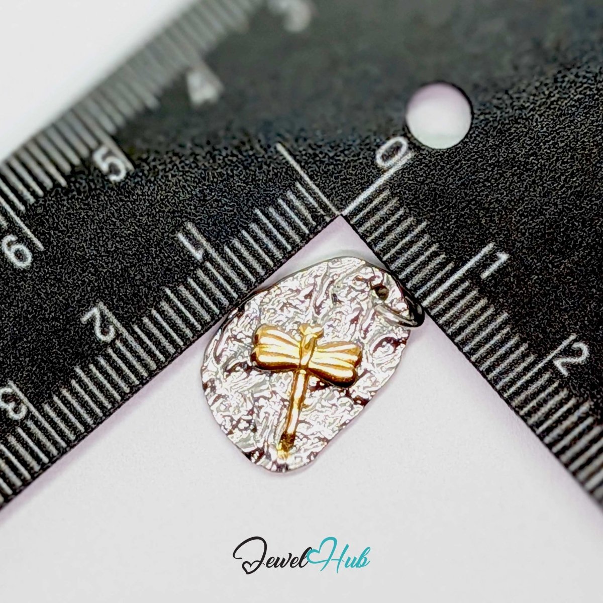 Two-tone dragonfly charm measured against a ruler at 13.5mm wide by 19.4mm tall - JewelHub