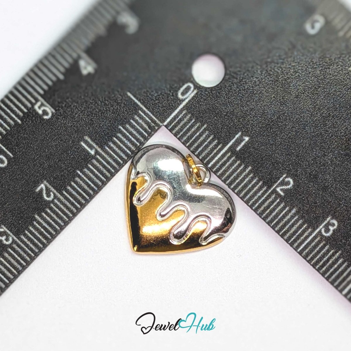 Drip Heart charm, two-tone stainless steel, measured against a ruler at 20 x 18.3mm - JewelHub
