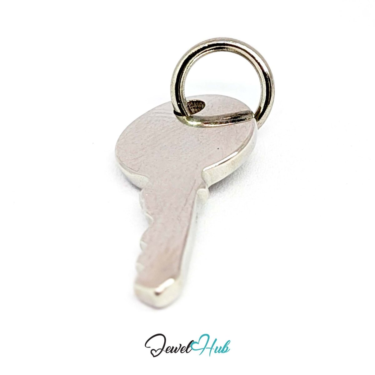 Everyday key charm in silver stainless steel with a plain round head - turned to show depth - JewelHub