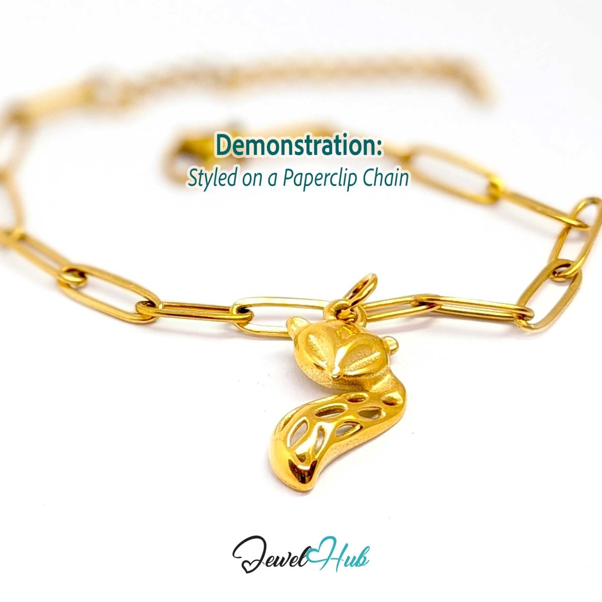 Gold fox charm styled on a gold paperclip chain bracelet - JewelHub