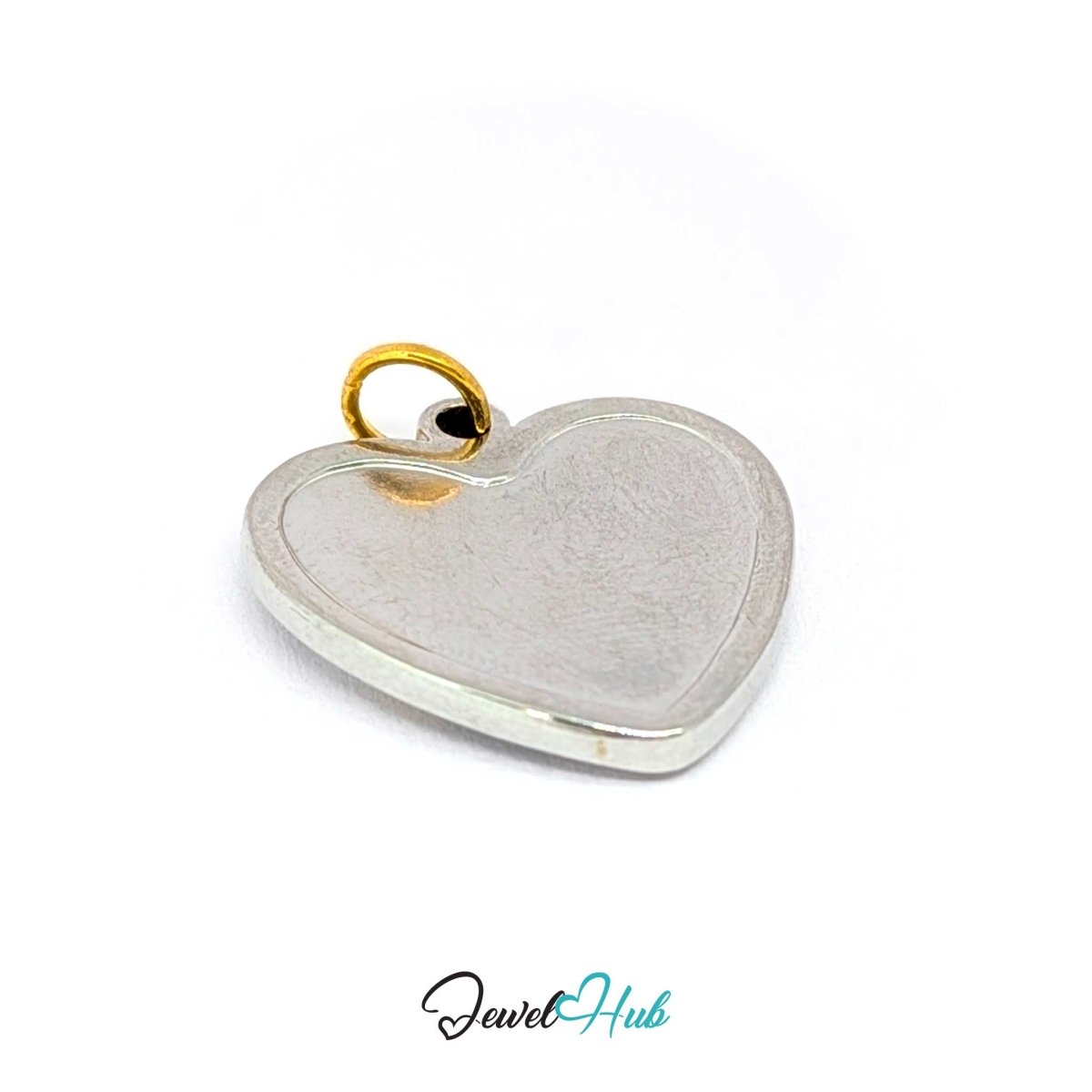 Heart Cluster charm turned to its plain silver reverse, showing the 2.2mm thickness - JewelHub