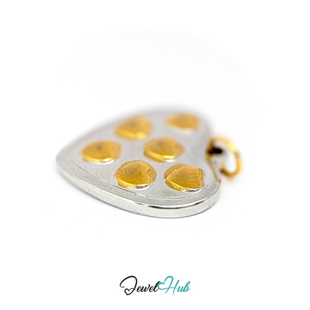 Heart Cluster charm at an angle, showing the raised rim running round the edge - JewelHub