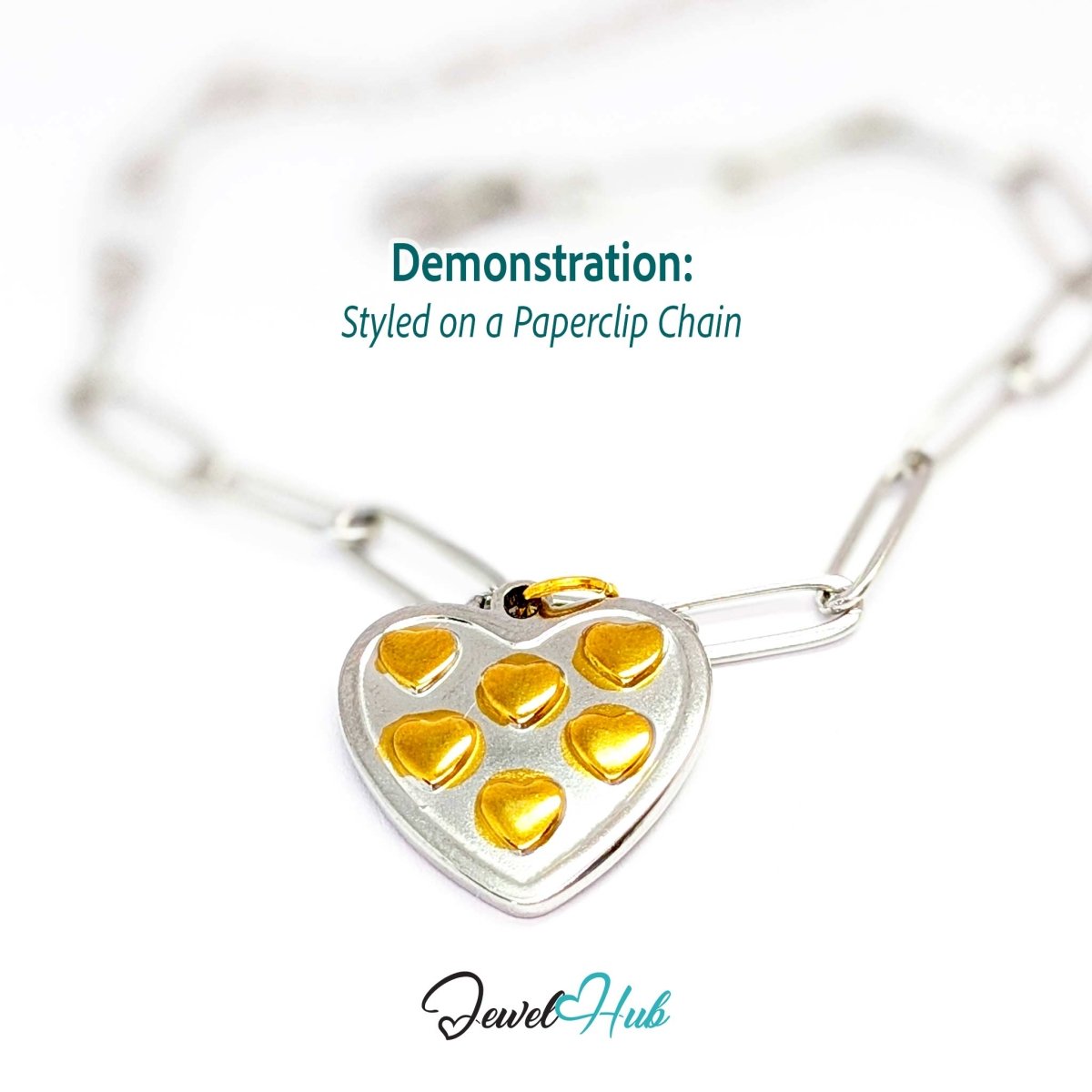 Two-tone Heart Cluster charm styled on a silver paperclip chain bracelet - JewelHub