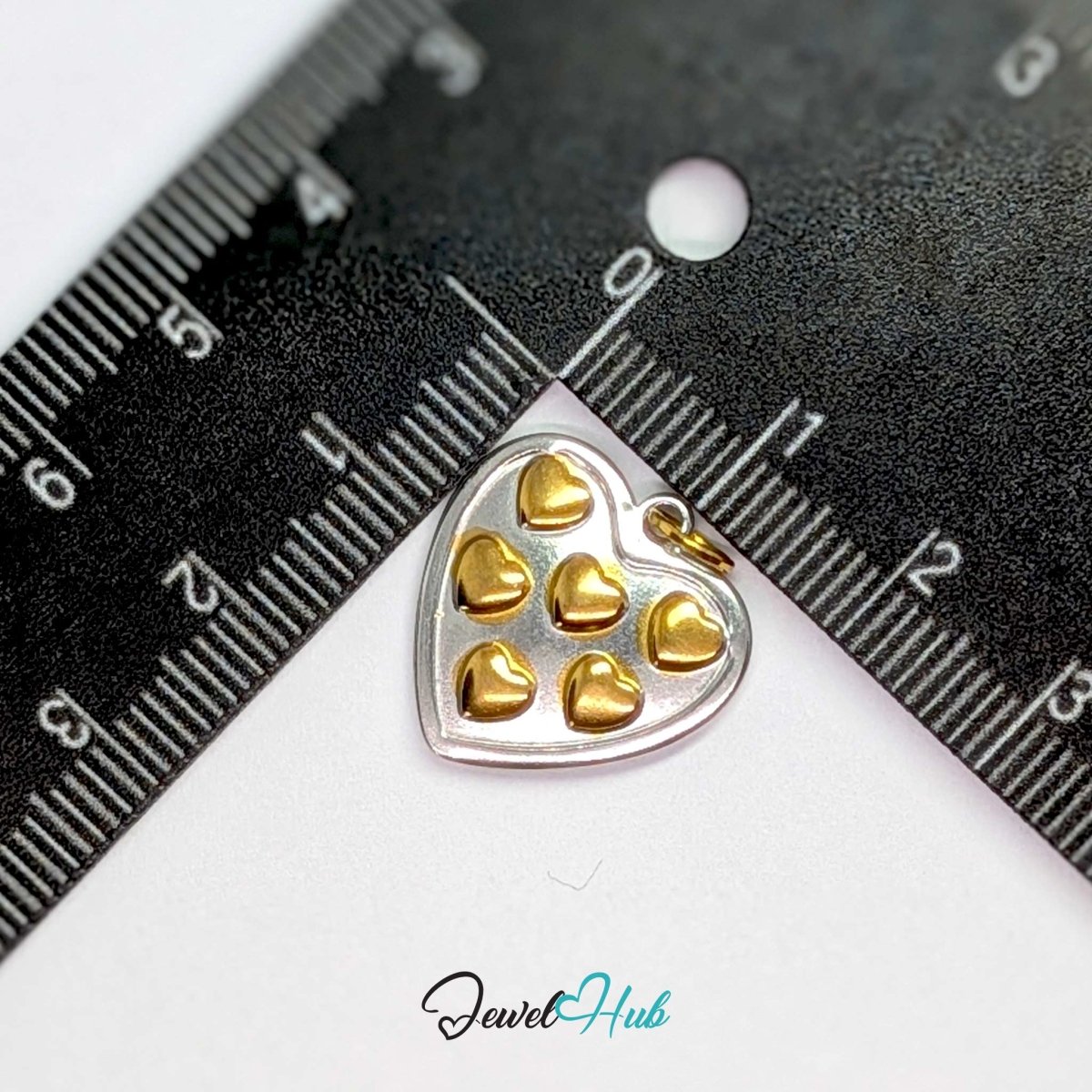 Heart Cluster charm measured against a ruler at 18.4mm wide by 17.6mm tall - JewelHub