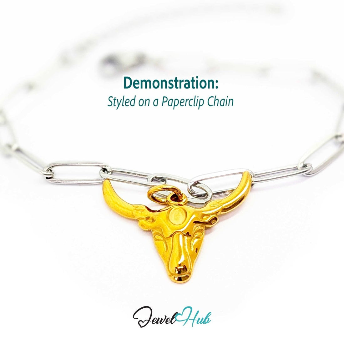 Gold longhorn bull head charm styled on a silver paperclip chain bracelet for a two-tone look - JewelHub
