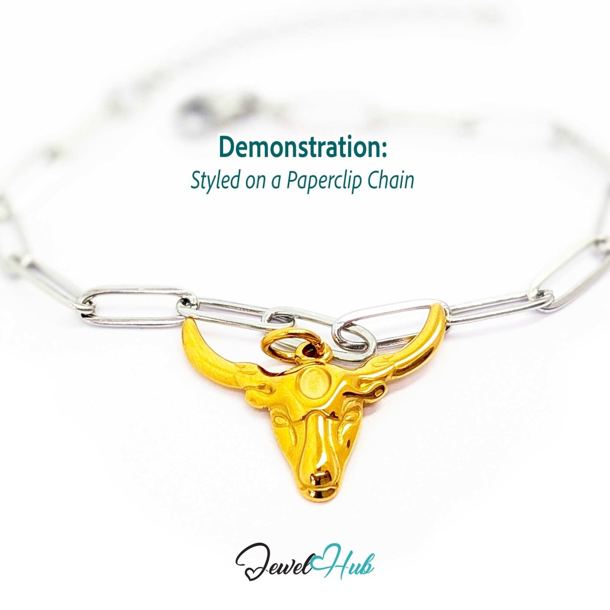 Gold longhorn bull head charm styled on a silver paperclip chain bracelet for a two-tone look - JewelHub