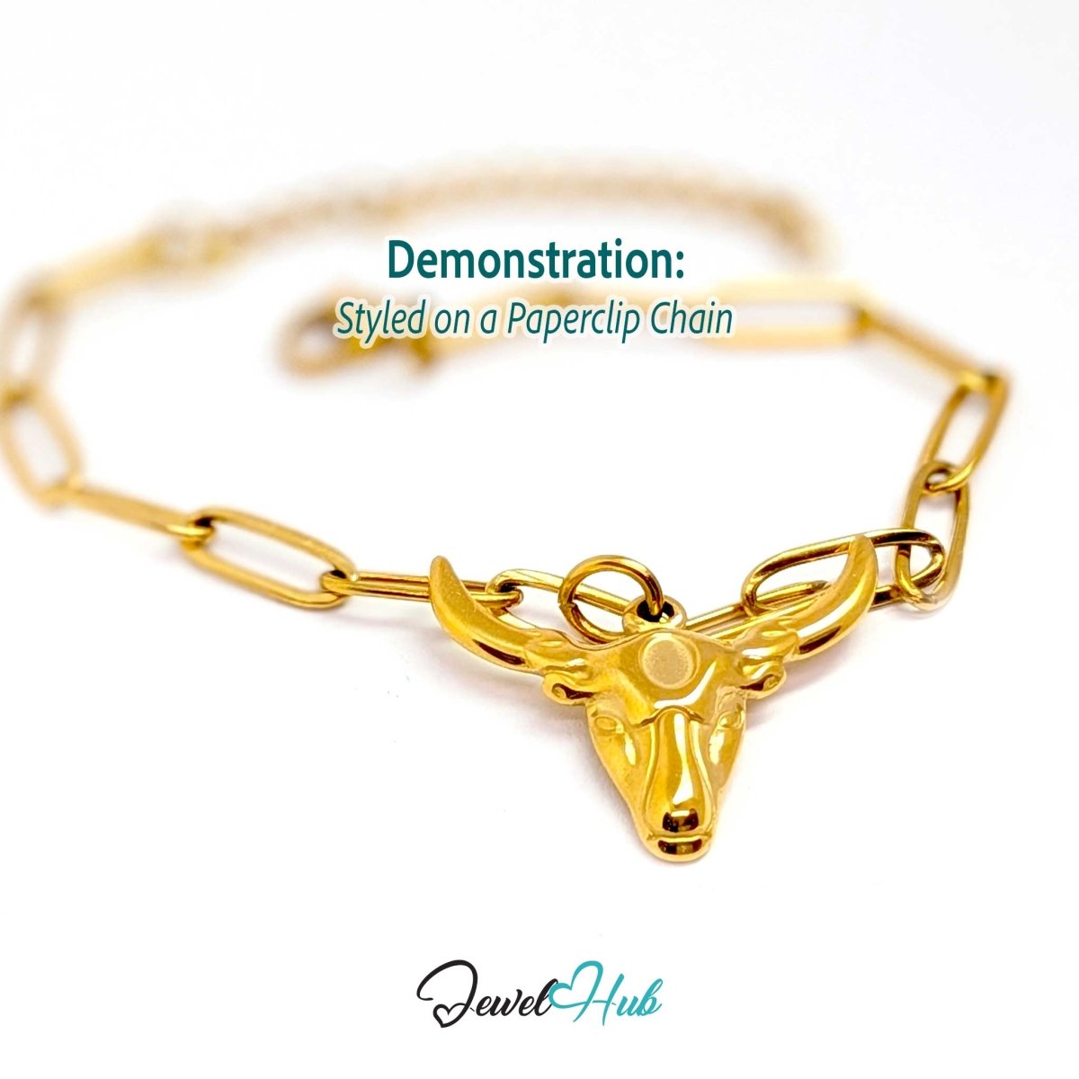 Gold longhorn bull charm styled on a gold paperclip chain bracelet - JewelHub