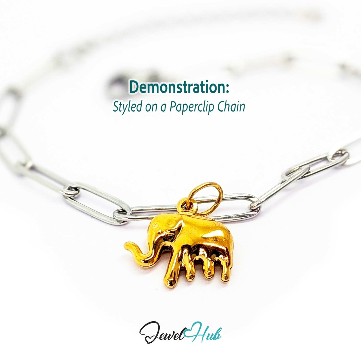 Gold lucky elephant charm styled on a silver paperclip chain bracelet for a two-tone look - JewelHub