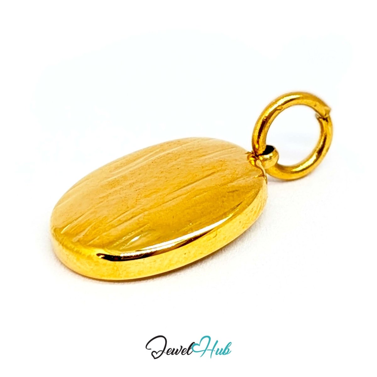 Oval cross medallion charm in gold stainless steel - turned to show depth - JewelHub