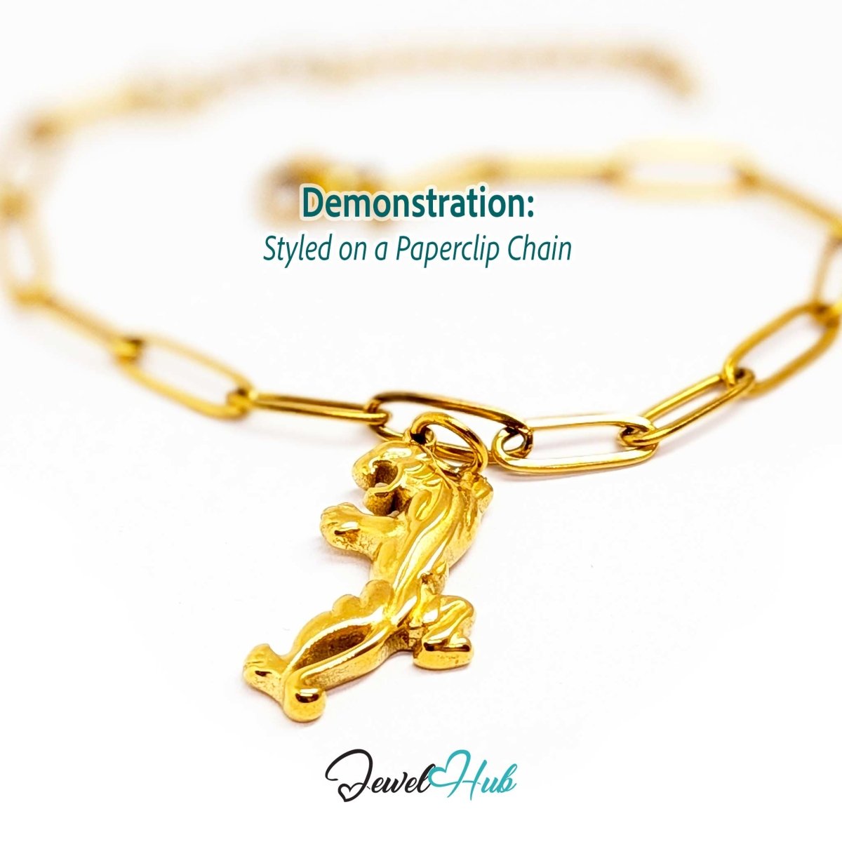 Gold prowling tiger charm styled on a gold paperclip chain bracelet - JewelHub