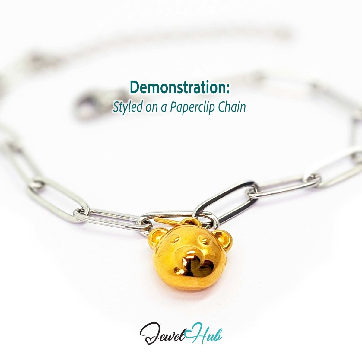 Gold classic round bear head charm styled on a silver paperclip chain bracelet for a two-tone look - JewelHub