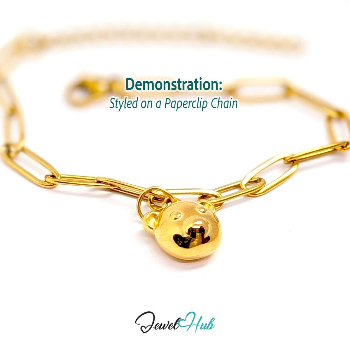 Gold classic round bear head charm styled on a gold paperclip chain bracelet - JewelHub