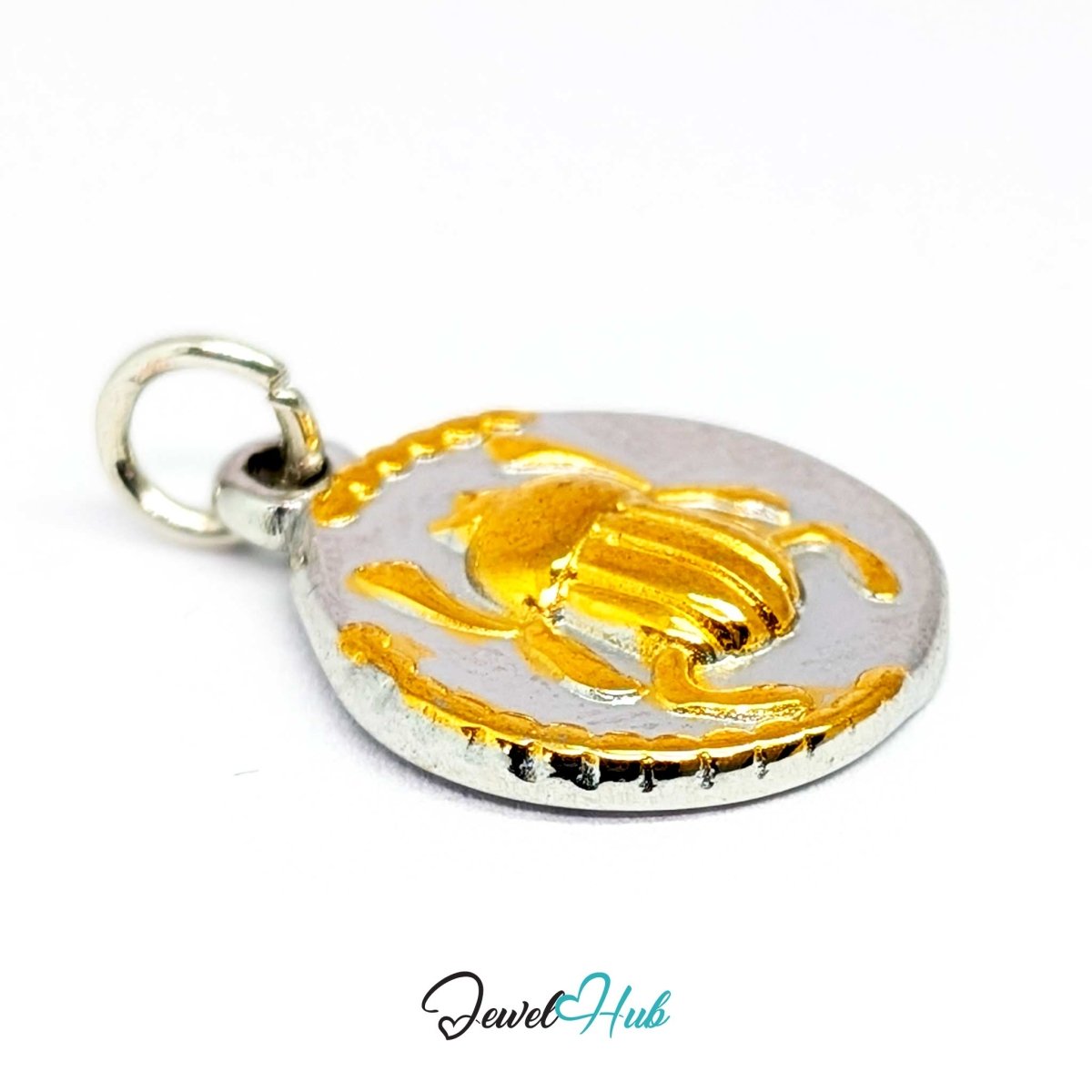 Scarab Oval charm at an angle, two-tone stainless steel - the modelled wing cases and gold rim - JewelHub