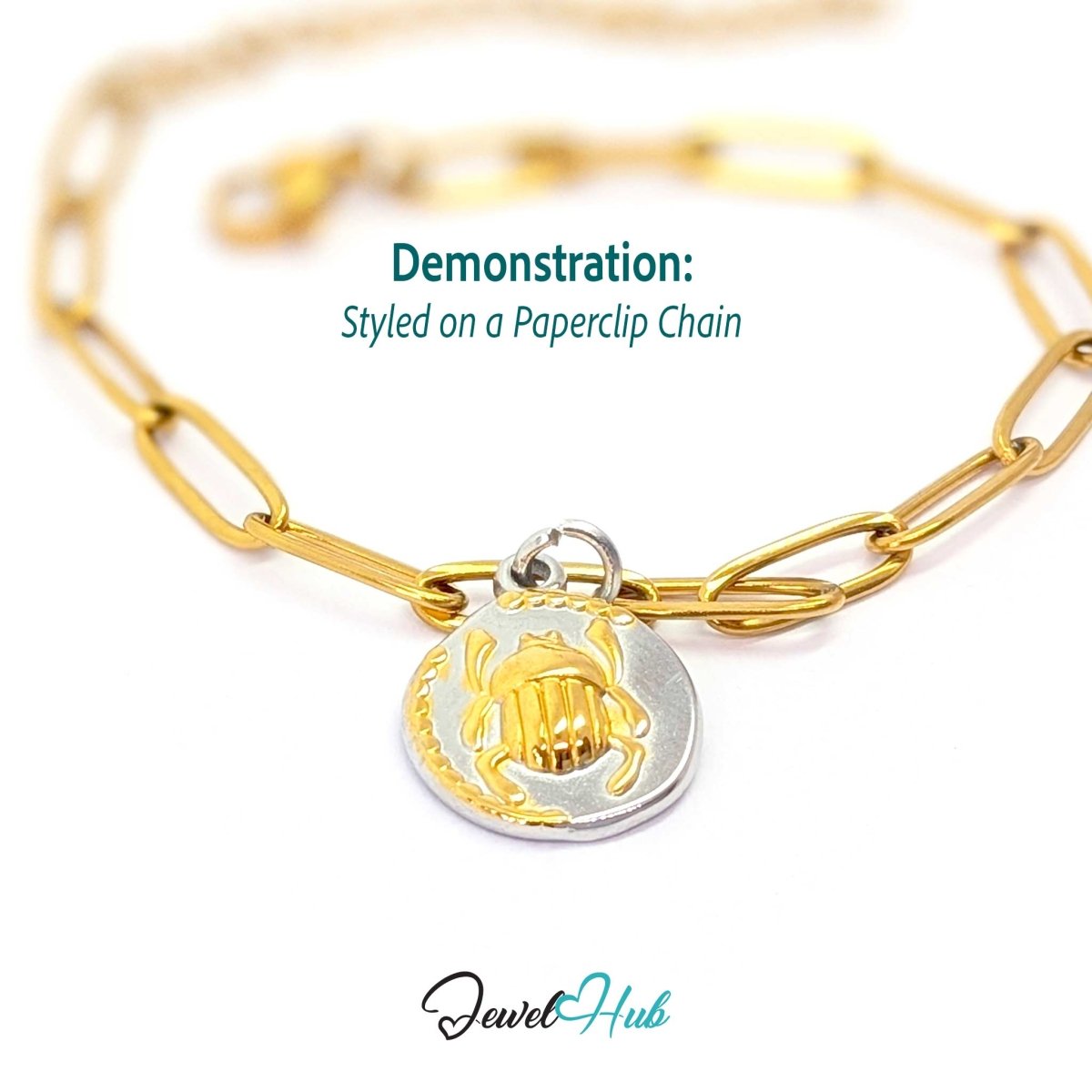 Scarab Oval charm, two-tone stainless steel, styled on a gold paperclip chain bracelet - JewelHub