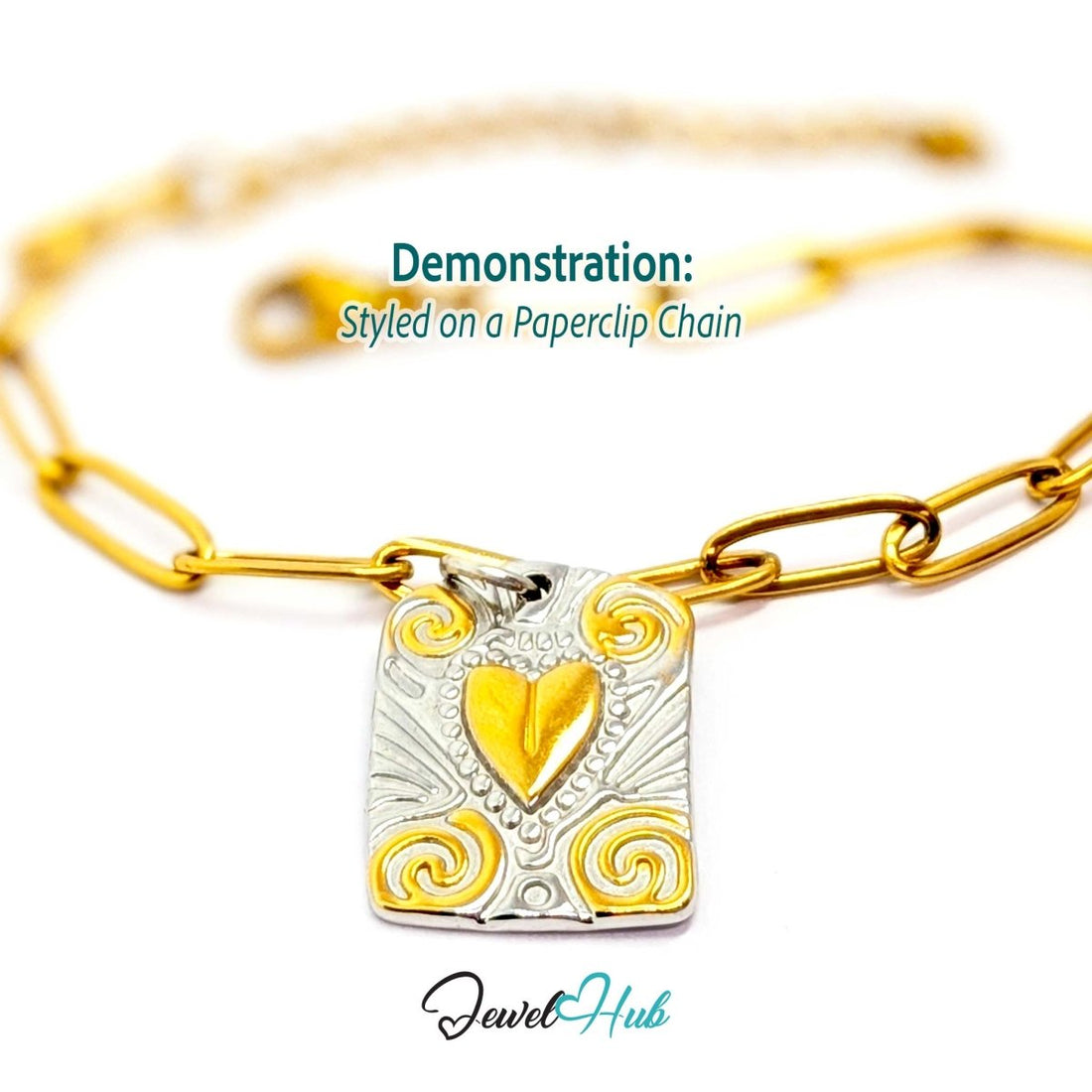 Two-tone Scroll Plaque charm styled on a gold paperclip chain bracelet - JewelHub